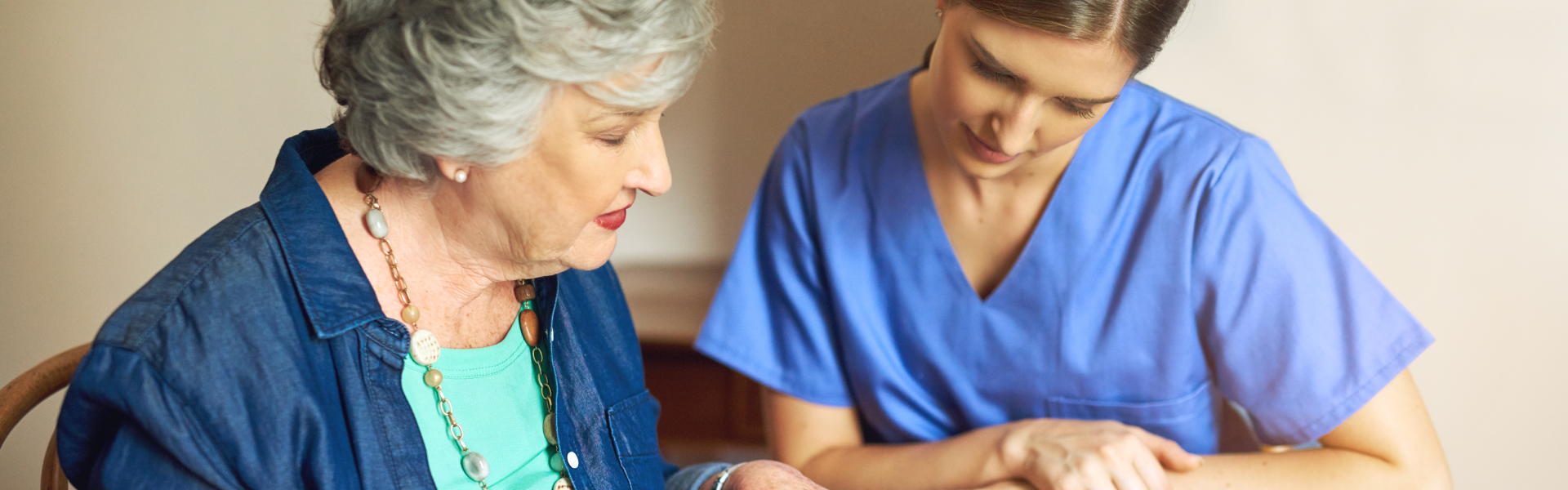 Female caregiver help and guide the elder woman